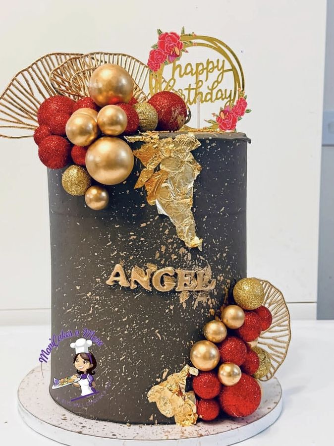 Black, red and gold celebration cake